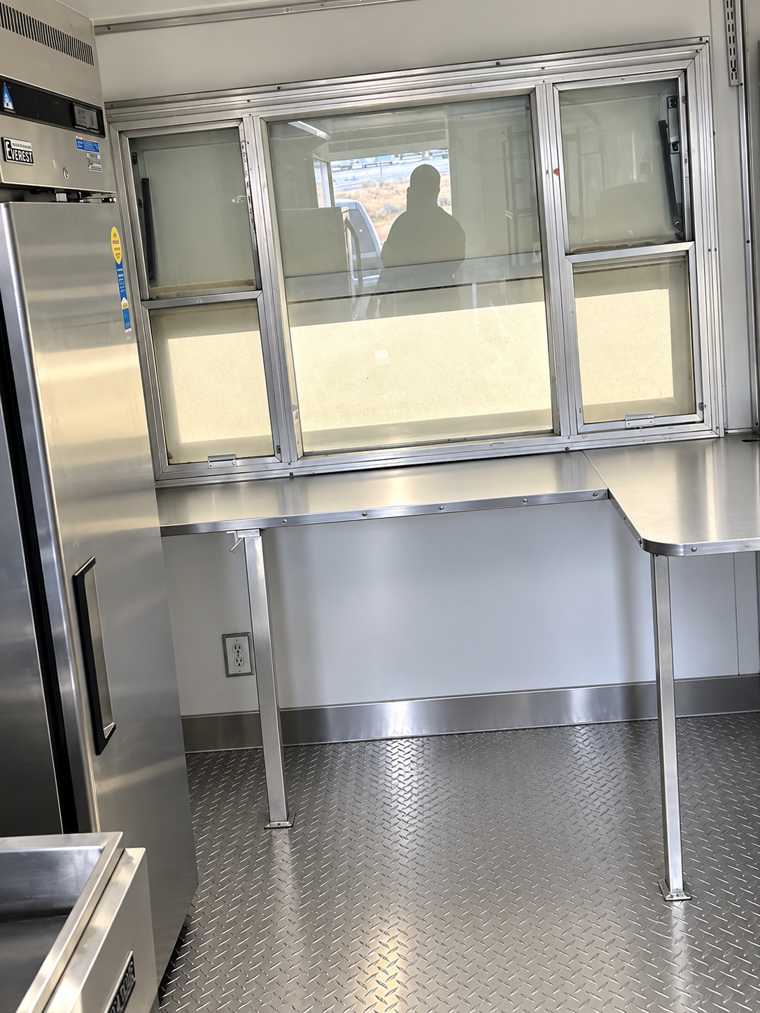 Preparation counter inside a mobile commercial kitchen trailer